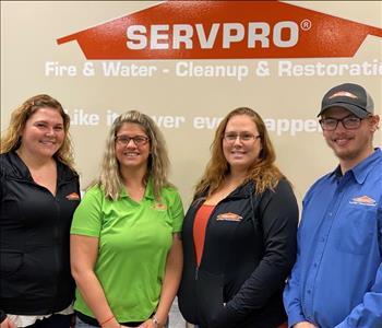 3 Females and 1 Male in SERVPRO uniform